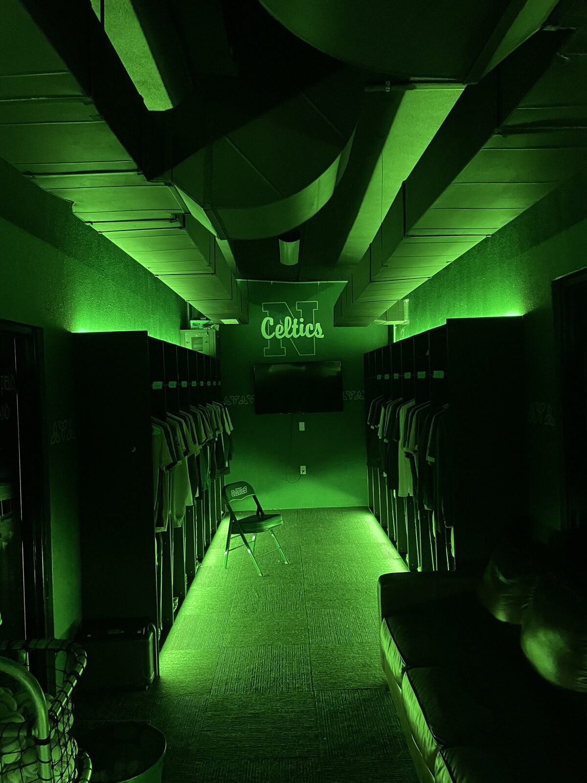 Team locker room lit with green LED color lighting